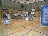 #587. Main Quilt Show - center shop toward 1st cloths line